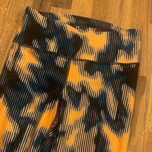 Under Armour compression workout tights. Phone pocket on right side. Medium.